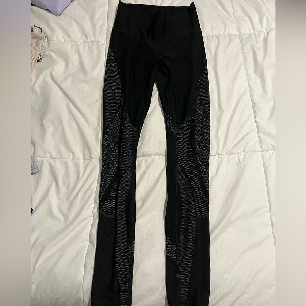 Black Lululemon leggings with white detailing